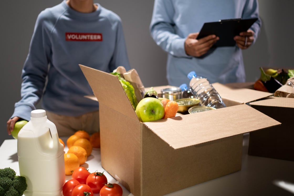 Volunteers preparing boxes of food