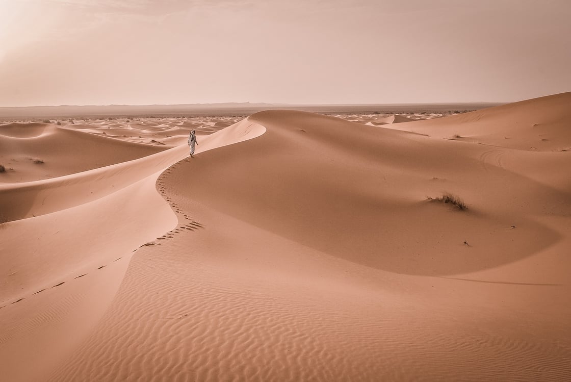 man-walking-in-desert