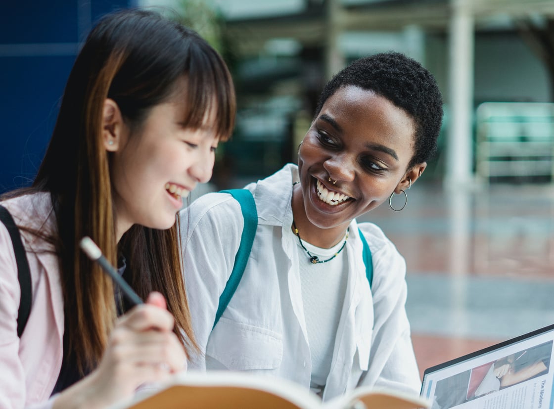 mulitracial-students-sitting-together-and-talking