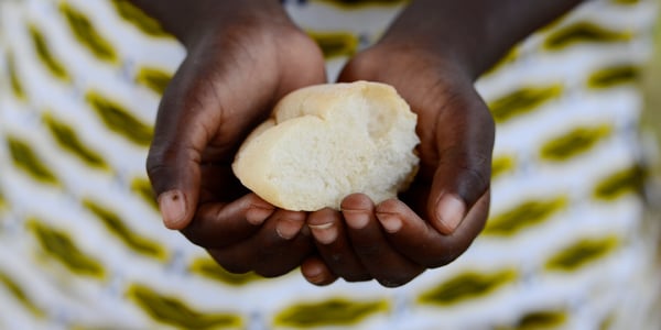 african-hands-cupping-bread