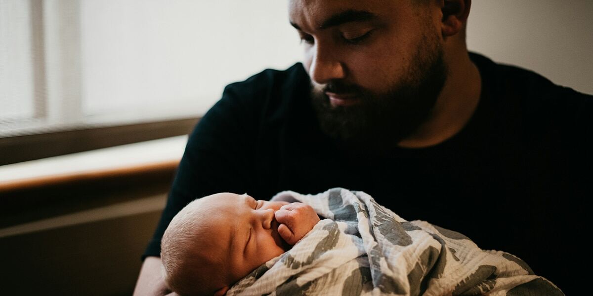 father_holding_baby