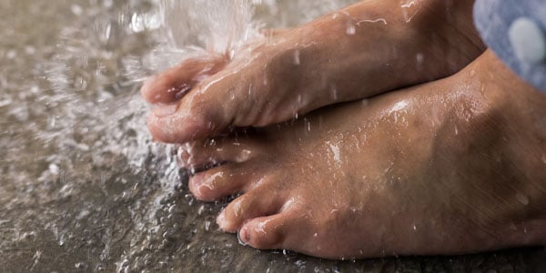 water splashing on bare feet