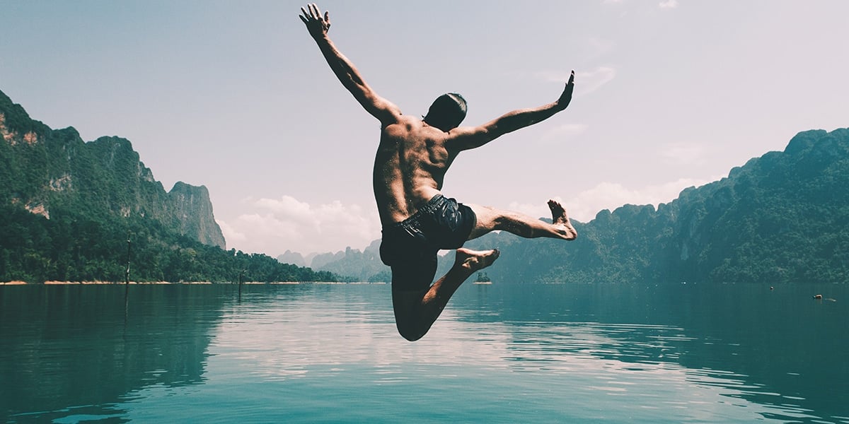 man-jumping-into-water