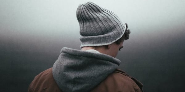 man-with-a-hat-looking-down-andrew-neel-via-unsplash-scaled-1