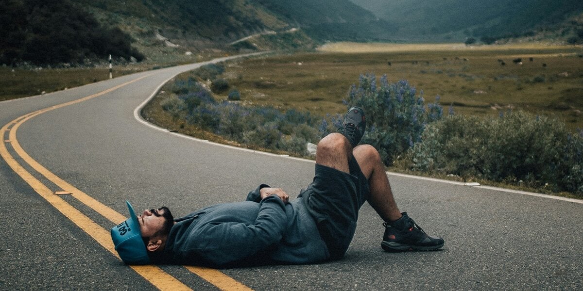 man_road_laying