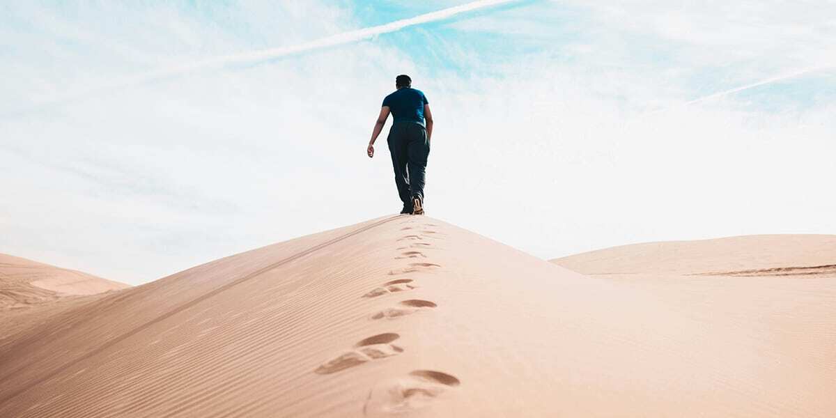 man_walking_desert