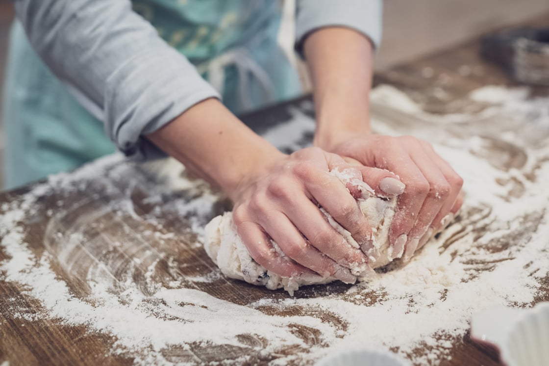 woman kneading dough