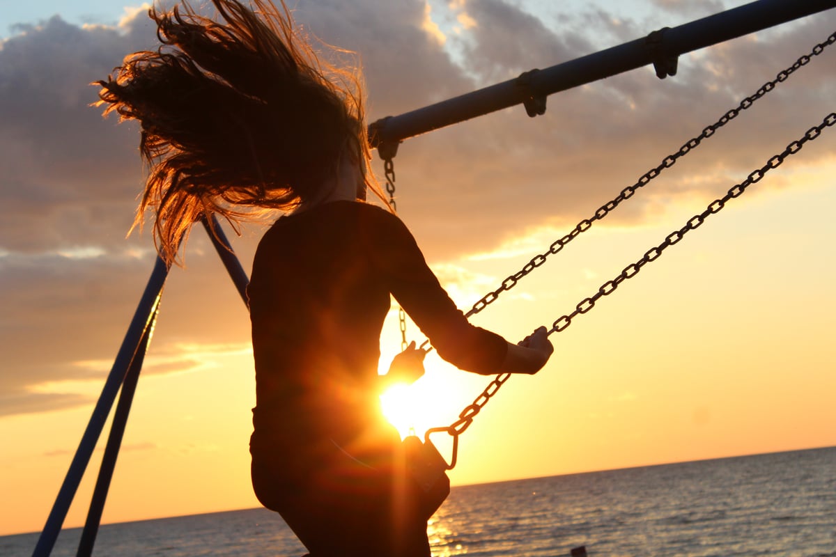 woman-on-a-swing-image-by-noah-silliman-via-unsplash