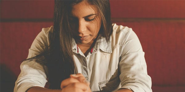 young woman praying