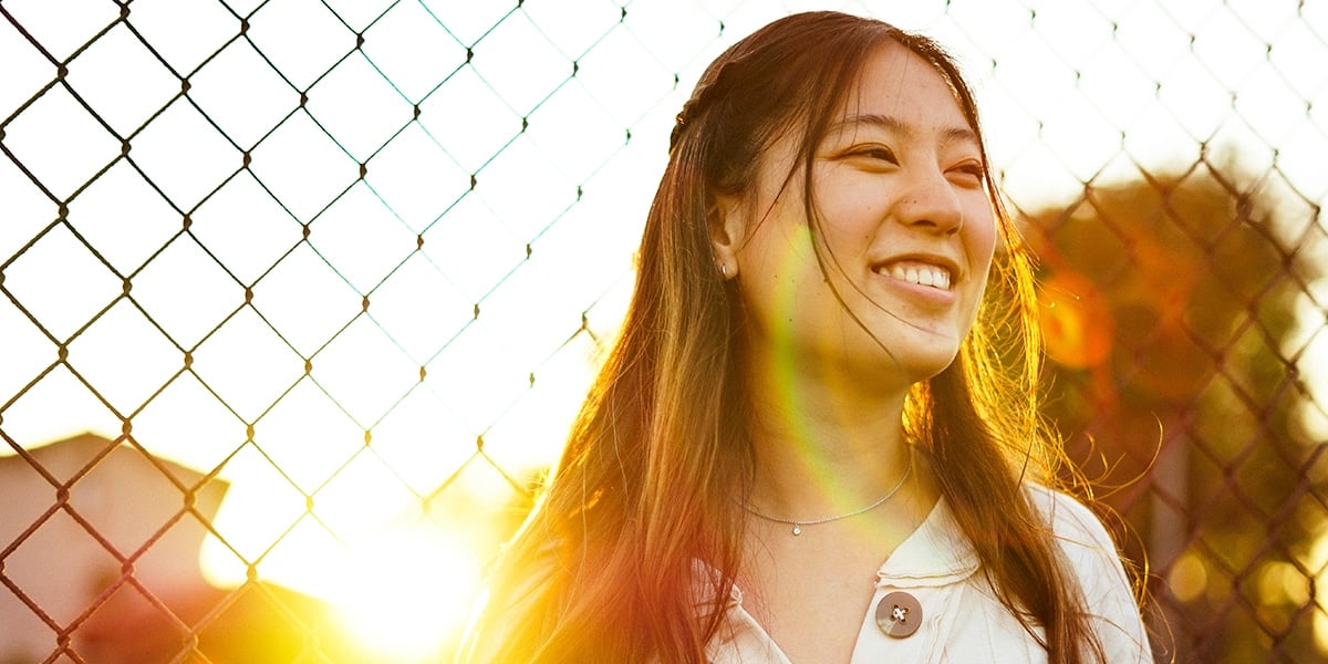 woman_joyful_fence (1)