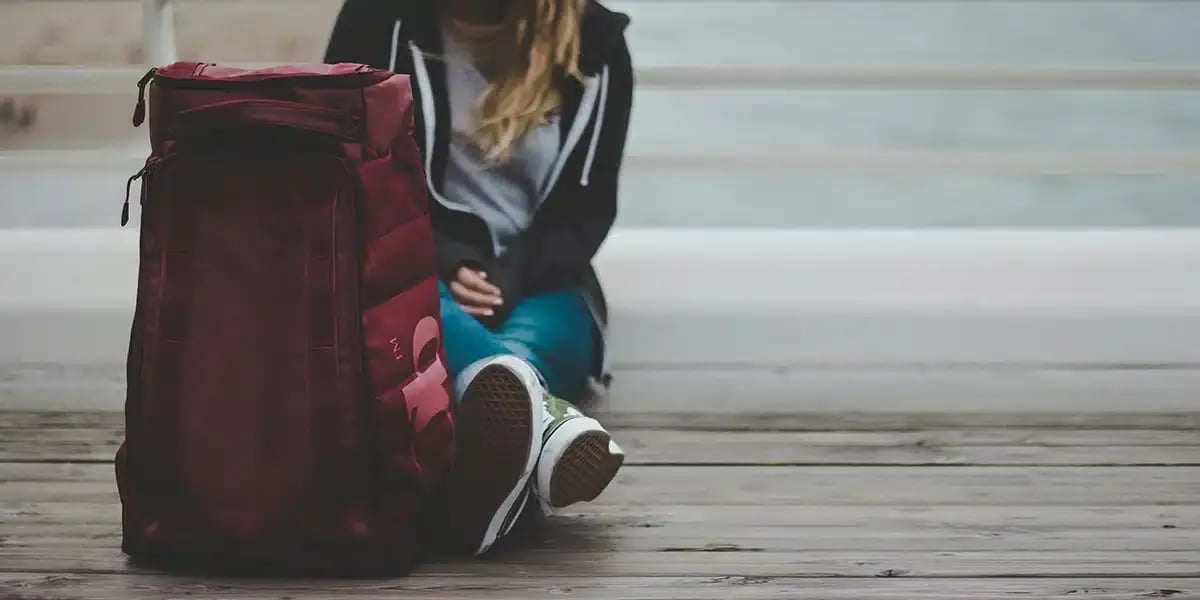 woman_sitting_backpack