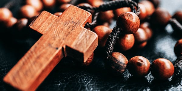 wooden rosary beads and cross