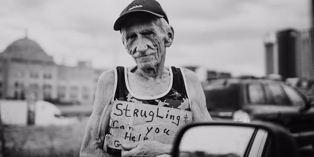 man_homeless_sign