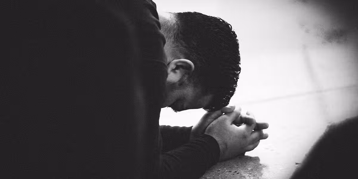 man_praying_surrender