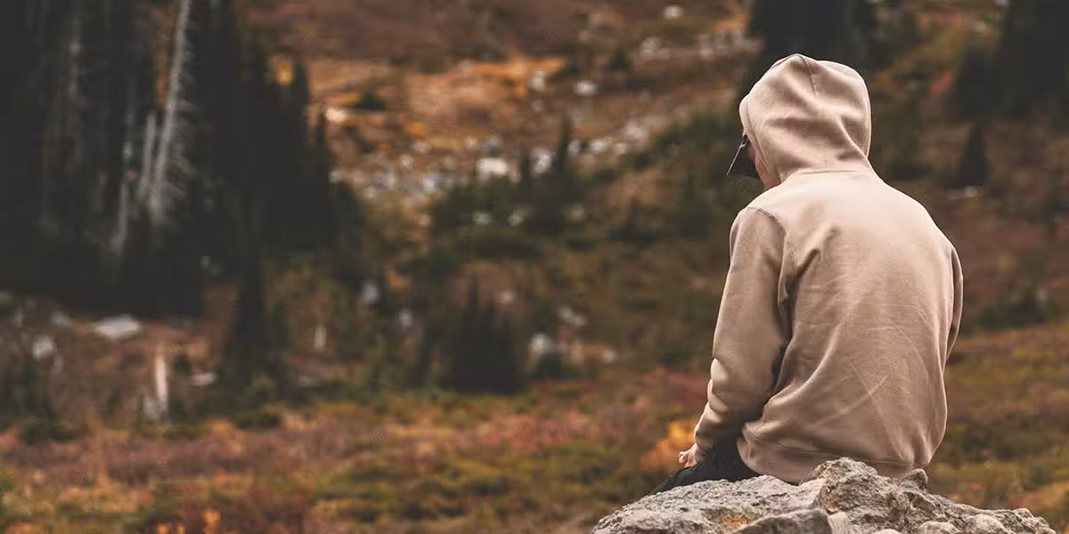 man_sad_rock